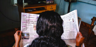 Assessing news value Photo of woman reading newspaper by Photo by Abhijith S Nair on Unsplash