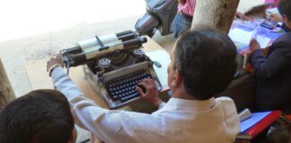 The qualities of a journalist Man working on typewriter, image by Media Helping Media