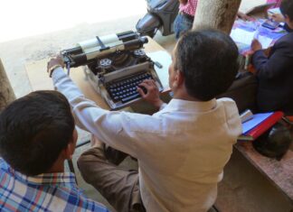 The qualities of a journalist Man working on typewriter, image by Media Helping Media