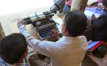 The qualities of a journalist Man working on typewriter, image by Media Helping Media