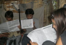 Setting up refugee media in exile Bhutanese refugees reading a copy of The Bhutan Reporter in the Beldangi-II refugee camp. Photo by TP Mishra.
