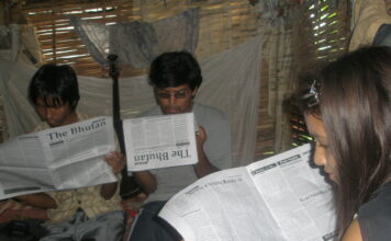 Setting up refugee media in exile Bhutanese refugees reading a copy of The Bhutan Reporter in the Beldangi-II refugee camp. Photo by TP Mishra.