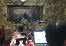 Editing audio for radio news Journalists James Innocent Ali (background) and Bakhita Aluel recording links at Radio Easter in South Sudan.