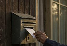 Doorstepping – scenario Image of a note being posted through a letterbox by Google Gemini Imagen 3