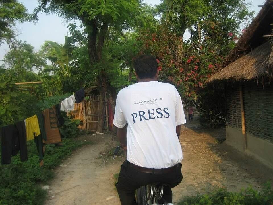 The author, TP Mishra, cycling to cover a story in the refugee camp - Image by Arjun Pradhan