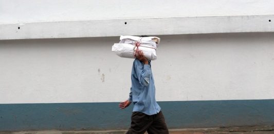 The author delivering copies of The Bhutan Reporter Monthly. Photo/Laura Pohl