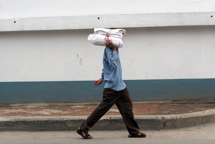 The author delivering copies of The Bhutan Reporter Monthly. Photo/Laura Pohl