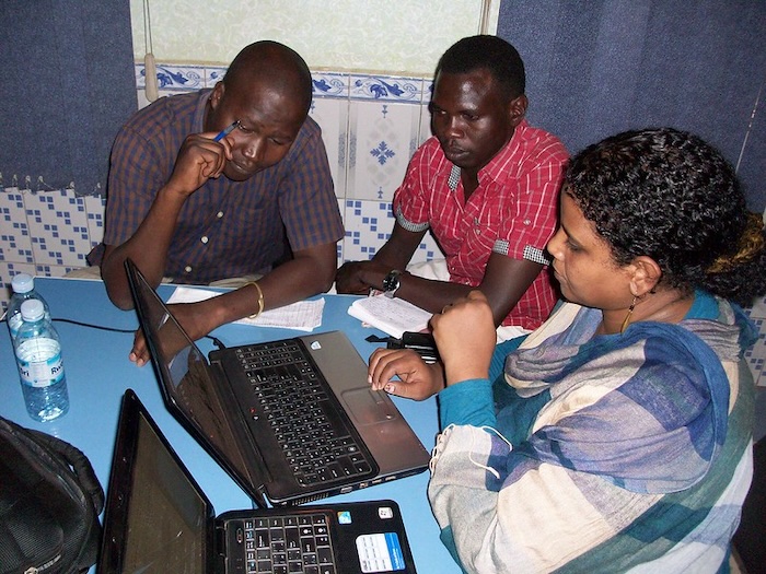 Editors from Hurriyat Sudan working on the business model - image by David Brewer of Media Helping Media
