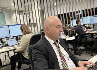 How to be a hands-on editor Image of editor working in a newsroom - created with an original image and Google Gemini AI