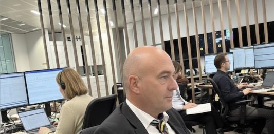 Image of editor working in a newsroom - created with an original image and Google Gemini AI