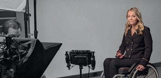 Journalist reporting on camera from wheelchair - image by Jordan Nicholson - Creative Commons BY-NE 4.0