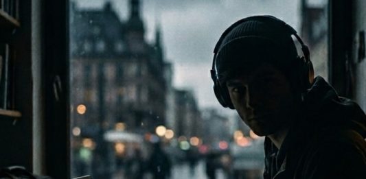 Image of a journalist working at a computer - created using Gemini AI