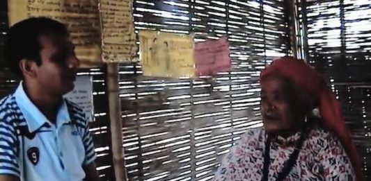 The author interviewing an elderly Bhutanese refugee mother in a refugee camp in Jhapa, Nepal, in 2009