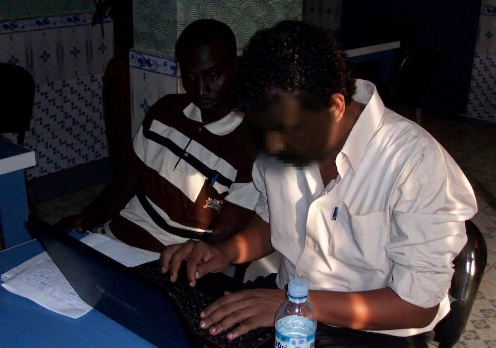 A journalist working in exile in Africa and writing under a false name - face blurred for safety reasons