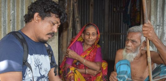 The author - Rafiqul Islam Montu - with coastal flooding victims