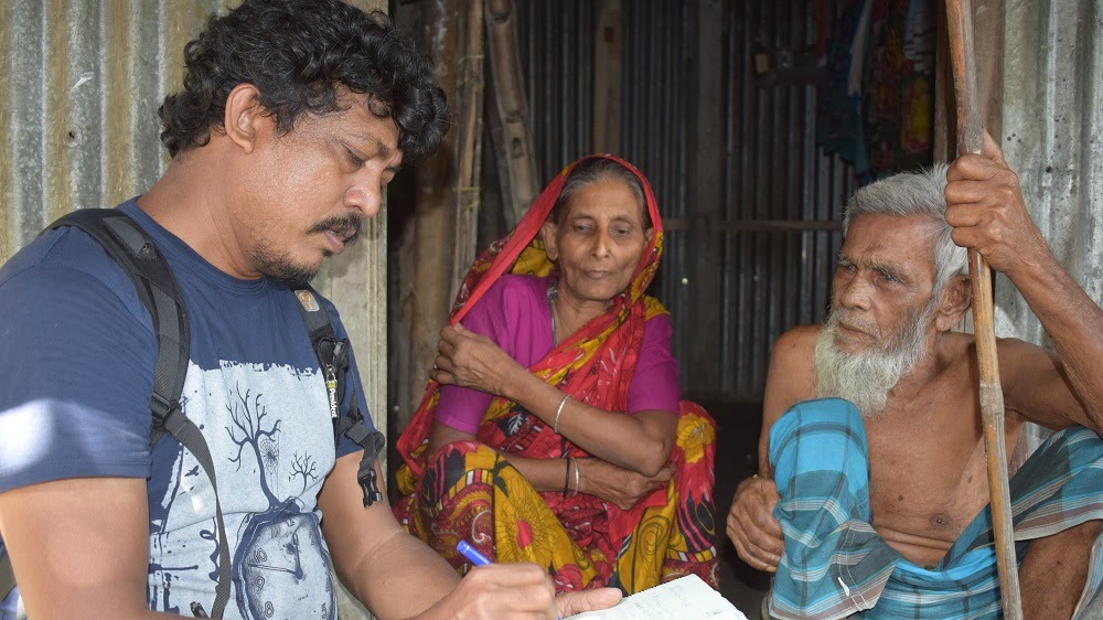 The author - Rafiqul Islam Montu - with coastal flooding victims